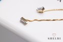 Złote kolczyki długie wiszące łańcuszki z diamentem Staviori