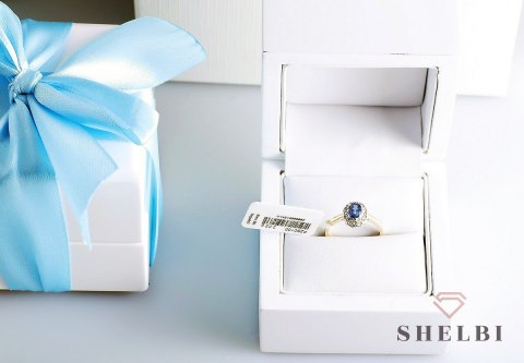 Złoty pierścionek szafir i diamenty pr. 585 białe i żółte złoto Złoty pierścionek szafir i diamenty pr. 585 białe i żółte złoto