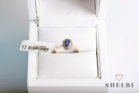 Złoty pierścionek szafir i diamenty pr. 585 białe i żółte złoto Złoty pierścionek szafir i diamenty pr. 585 białe i żółte złoto